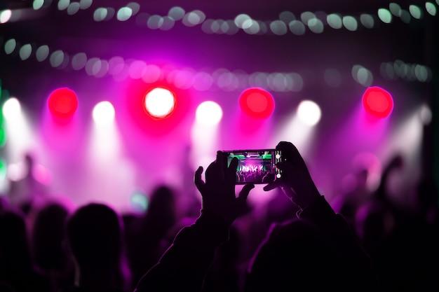 close up recording video with smartphone during concert 1153 7310 1